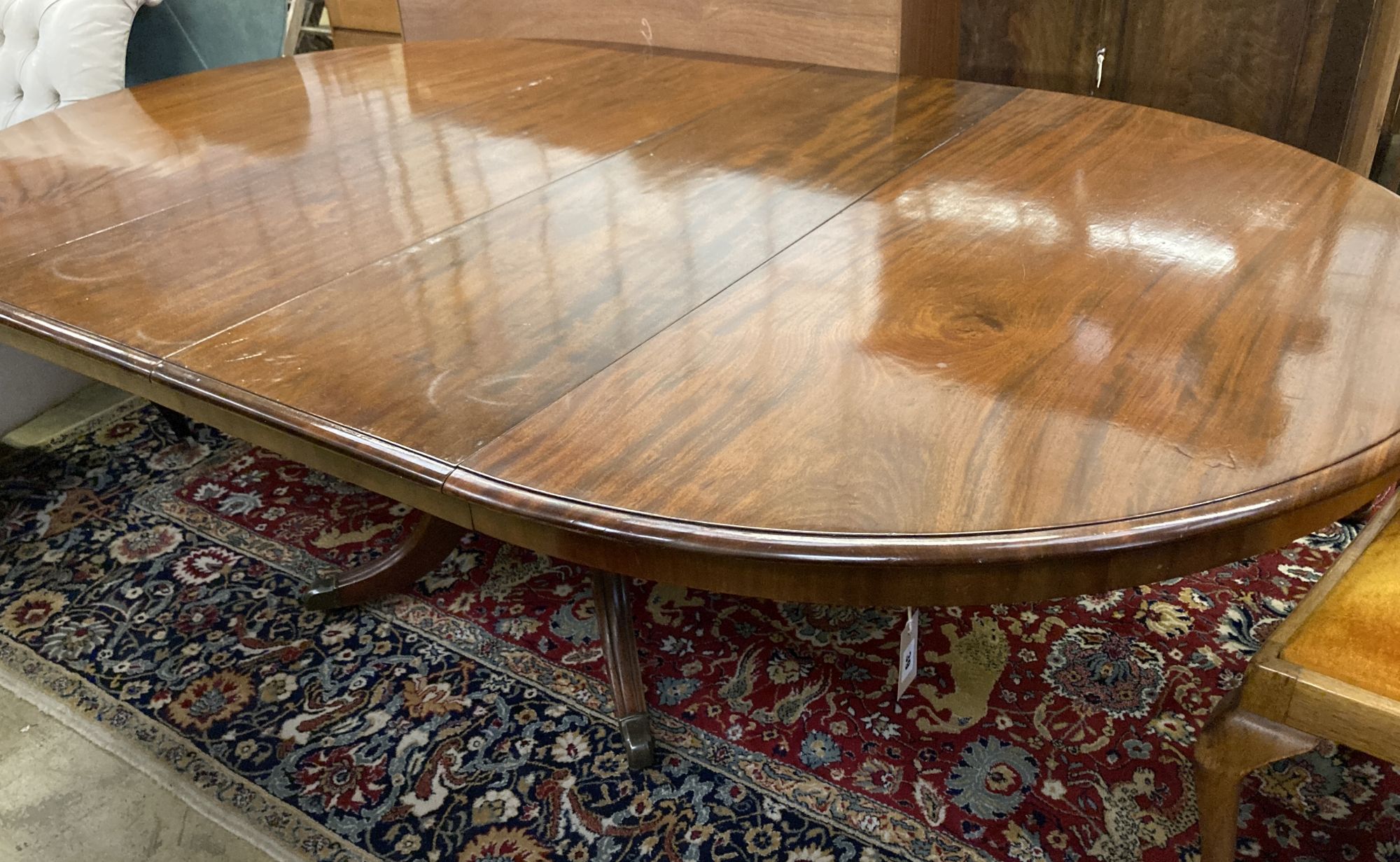 A William IV style extending mahogany dining table, 212cm extended (two spare leaves), width 136cm, height 73cm